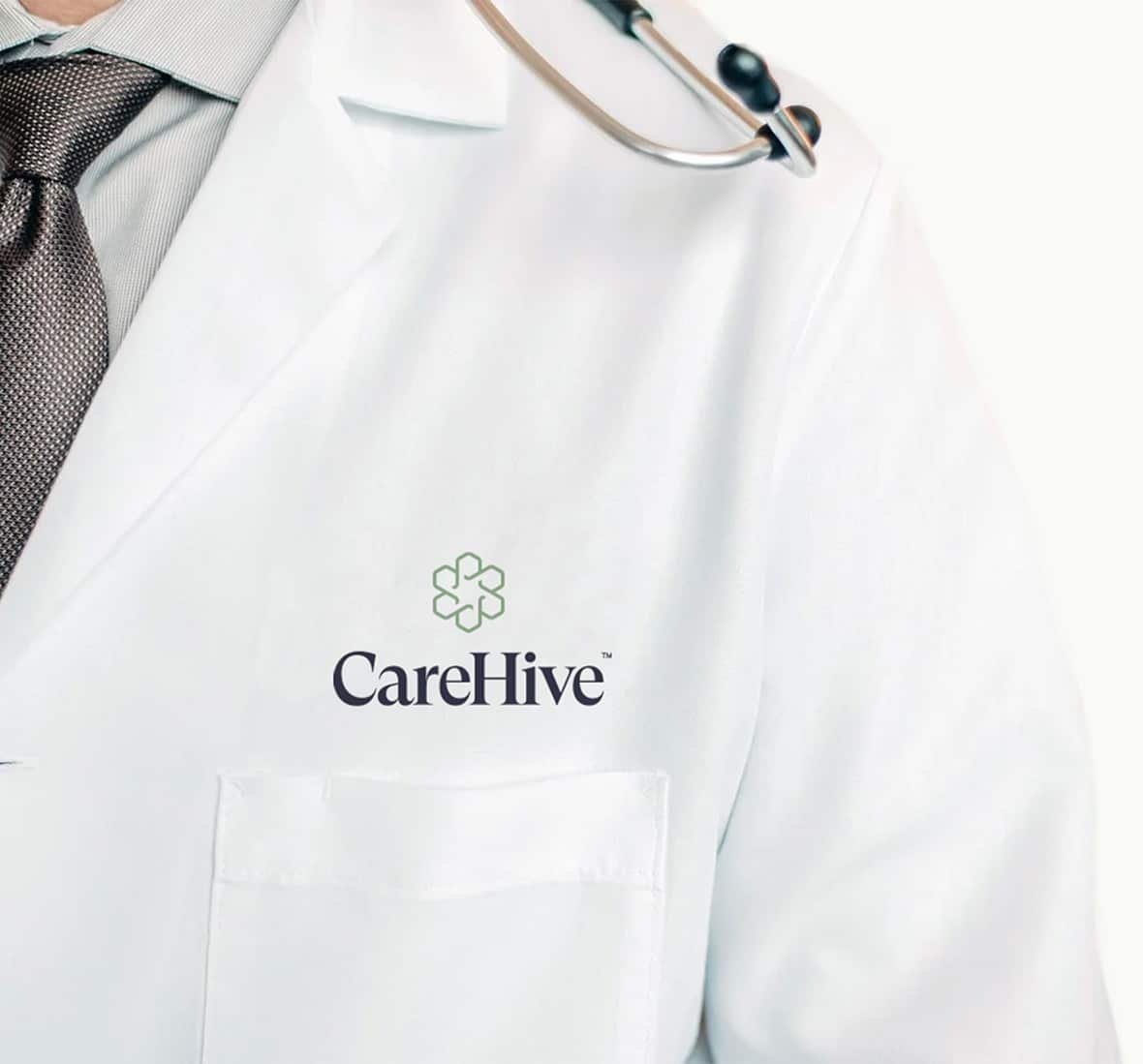 Image of a doctor's shoulder with the CareHive name and logo above their pocket.