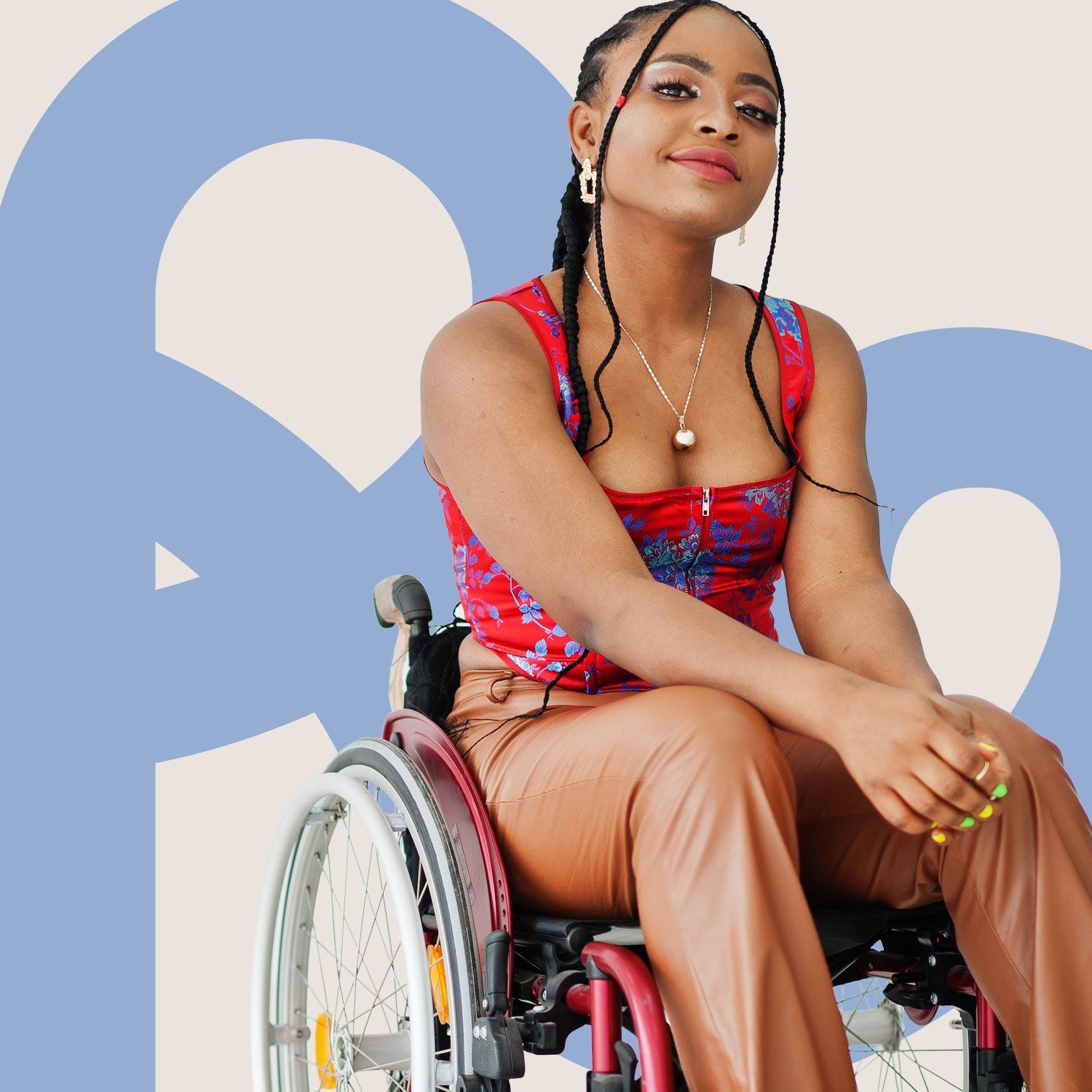 An image of a young woman smiling in a wheelchair, with the letters "Re" on the background behind her.