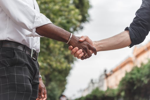 A person shaking hands with another person
