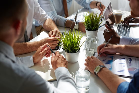 A digital marketing team discussing strategies for a CPG brand