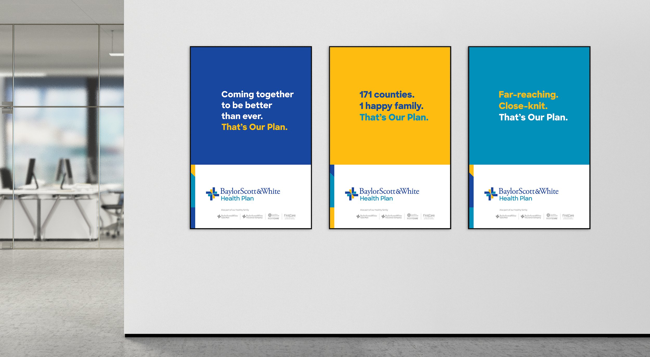 Three posters hang on a wall in an office Three posters hang on a wall in an office